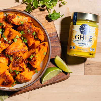 Prepared food plated next to 4th & Heart ghee.