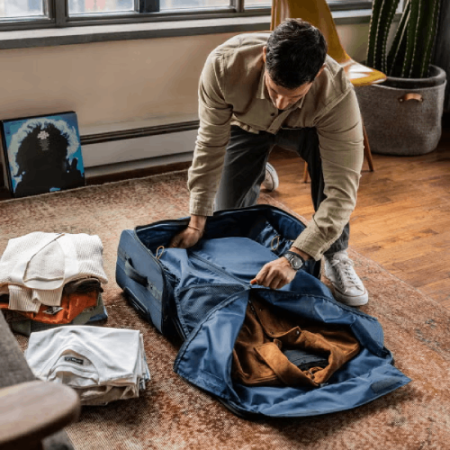 Halfday bag being packed with clothing.